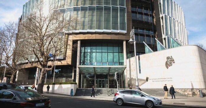 0_person-walking-in-front-of-the-criminal-courts-of-justice-in-dublin-ireland